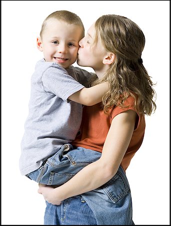 simsearch:640-01350077,k - Profile of a sister kissing her brother Fotografie stock - Premium Royalty-Free, Codice: 640-01360703