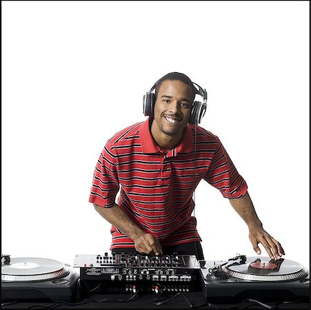 dj white background - DJ with headphones spinning records Stock Photo - Premium Royalty-Free, Code: 640-01360762