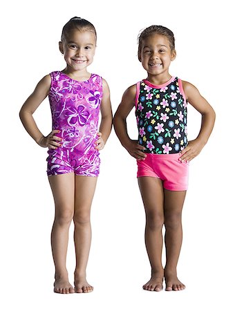 Two young female gymnasts with hands on hips Stock Photo - Premium Royalty-Free, Code: 640-01360763
