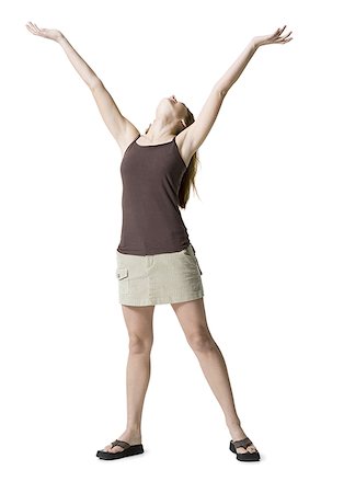 slippers women - Young woman standing with her arms raised Stock Photo - Premium Royalty-Free, Code: 640-01360778
