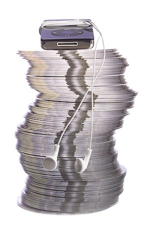 MP3 Player placed on top stack of CDs Stock Photo - Premium Royalty-Free, Code: 640-01360799