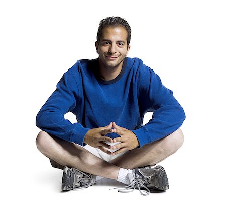 simsearch:640-01351214,k - Portrait of a young man sitting with his legs crossed Stock Photo - Premium Royalty-Free, Code: 640-01360821