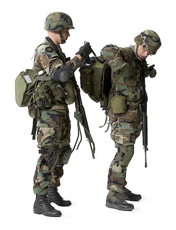 simsearch:640-01364108,k - Side profile of an army soldier adjusting the backpack of another soldier Stock Photo - Premium Royalty-Free, Code: 640-01360823
