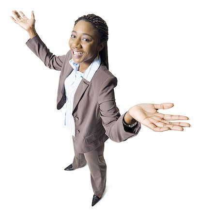Portrait of a businesswoman smiling with her arms outstretched Stock Photo - Premium Royalty-Free, Code: 640-01360889