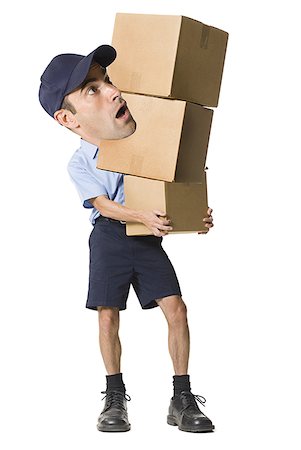 simsearch:640-01351214,k - Delivery man holding cardboard boxes Stock Photo - Premium Royalty-Free, Code: 640-01360899