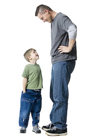 Father and his son looking at each other Stock Photo - Premium Royalty-Free, Code: 640-01360891