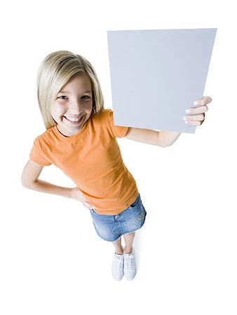shoe overhead on white - Portrait of a girl holding a blank sign Stock Photo - Premium Royalty-Free, Code: 640-01360910