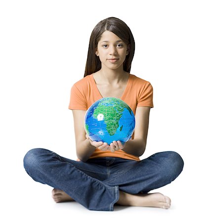 preteen jeans girl model - Portrait of a girl holding a globe Stock Photo - Premium Royalty-Free, Code: 640-01360913