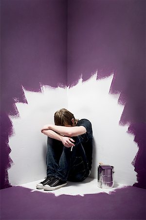 sad picture of a teenage boy alone - Close-up of a teenage boy holding a cigarette Stock Photo - Premium Royalty-Free, Code: 640-01360926