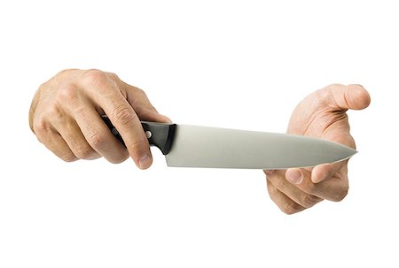 Close-up of a knife in a man's hand Foto de stock - Sin royalties Premium, Código: 640-01360927