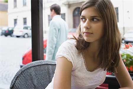 people coffee bar - Close-up of a young woman sitting in a cafe Stock Photo - Premium Royalty-Free, Code: 640-01360952