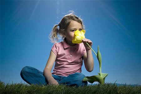 smelling hair - Portrait of a girl smelling a flower Stock Photo - Premium Royalty-Free, Code: 640-01361024