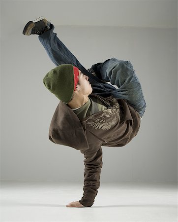dance coat - Young man break dancing Stock Photo - Premium Royalty-Free, Code: 640-01361117