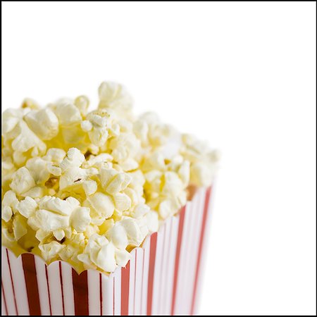 popcorn white background - Detailed view of box of popcorn Stock Photo - Premium Royalty-Free, Code: 640-01361119