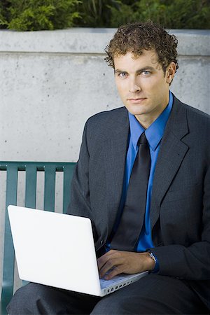 simsearch:640-01355559,k - Portrait of a businessman using a laptop Stock Photo - Premium Royalty-Free, Code: 640-01361163