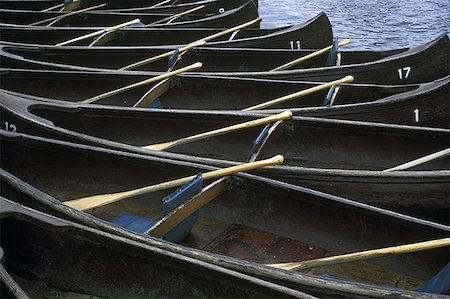 High angle view of a line of canoes Stock Photo - Premium Royalty-Free, Code: 640-01361247