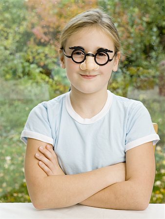 Portrait of a girl wearing a mask Stock Photo - Premium Royalty-Free, Code: 640-01361269