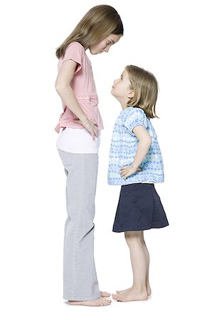 sister sister fights - Profile of two sisters looking at each other Stock Photo - Premium Royalty-Free, Code: 640-01361287