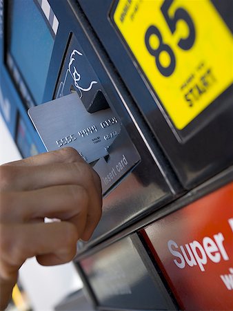 fuel filling - Close-up of a person paying for gas with a credit card Stock Photo - Premium Royalty-Free, Code: 640-01361387