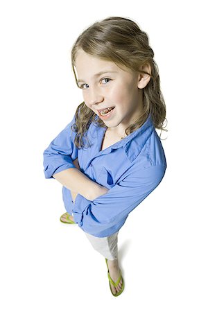 flip flop kids - Portrait of a girl standing with her arms folded Foto de stock - Sin royalties Premium, Código: 640-01361426