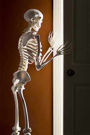 Skeleton opening door Stock Photo - Premium Royalty-Free, Code: 640-01361460