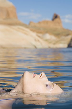 dulces - Profile of a young woman in a lake Stock Photo - Premium Royalty-Free, Code: 640-01361462