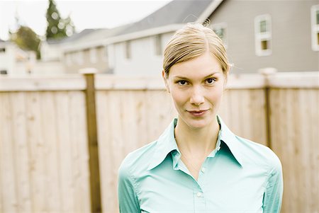 face close up dress shirts - Portrait of a young woman standing Stock Photo - Premium Royalty-Free, Code: 640-01361505