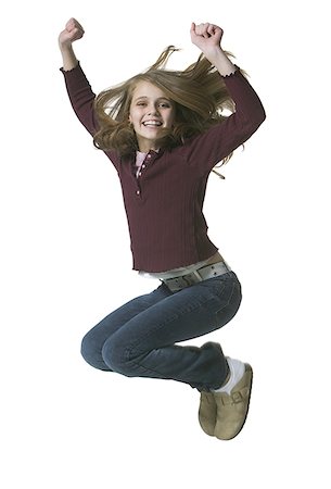 side profile jeans for girls - Portrait of a girl jumping with her arms raised Foto de stock - Sin royalties Premium, Código: 640-01361530