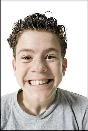 Portrait of a teenage boy grinning Stock Photo - Premium Royalty-Free, Code: 640-01361548