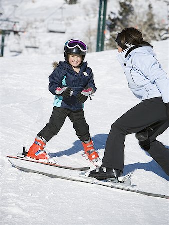 Woman and young girl skiing Stock Photo - Premium Royalty-Free, Code: 640-01361578