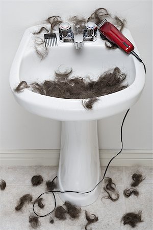 Bathroom sink with hair and electric razor Stock Photo - Premium Royalty-Free, Code: 640-01361584