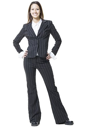 Portrait of a businesswoman standing with her hands on her hips Stock Photo - Premium Royalty-Free, Code: 640-01361680