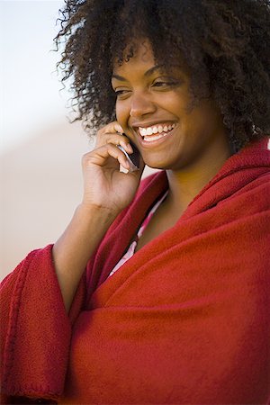 frizzy - Close-up of a young woman wrapped in a towel talking on a mobile phone Stock Photo - Premium Royalty-Free, Code: 640-01361770