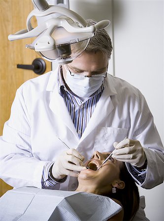 simsearch:640-02771776,k - Woman having dental examination Foto de stock - Royalty Free Premium, Número: 640-01361902