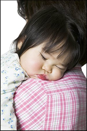 sleeping japanese baby - Close-up of a mother carrying her sleeping daughter Stock Photo - Premium Royalty-Free, Code: 640-01361976