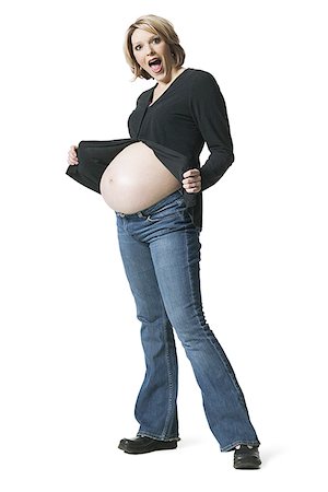 pregnant surprise - Side profile of a pregnant woman showing her stomach Stock Photo - Premium Royalty-Free, Code: 640-01362134