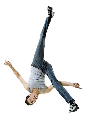 simsearch:640-01359391,k - Portrait of a young man doing a back flip Foto de stock - Royalty Free Premium, Número: 640-01362149