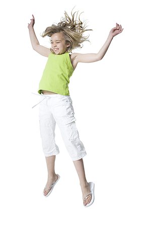 flip flop kids - Close-up of a girl jumping in mid air Foto de stock - Sin royalties Premium, Código: 640-01362140