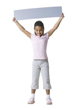 Portrait d'une jeune fille tenant une pancarte blanche Photographie de stock - Premium Libres de Droits, Code: 640-01362209