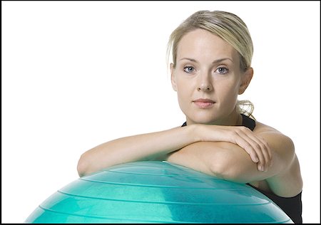 simsearch:640-01355937,k - Portrait of a young woman leaning on a fitness ball Foto de stock - Sin royalties Premium, Código: 640-01362264