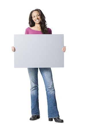 Portrait of a young woman holding a blank sign Stock Photo - Premium Royalty-Free, Code: 640-01362267