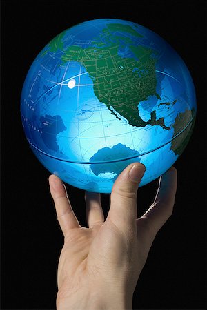 simulation - Close-up of a man's hand holding a globe Foto de stock - Sin royalties Premium, Código: 640-01362333
