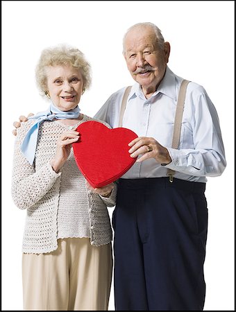 simsearch:640-01362854,k - Older man giving wife Valentines chocolate Stock Photo - Premium Royalty-Free, Code: 640-01362416