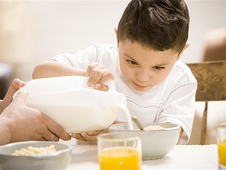 simsearch:640-03262648,k - Father and young son having breakfast together Stock Photo - Premium Royalty-Free, Code: 640-01362471