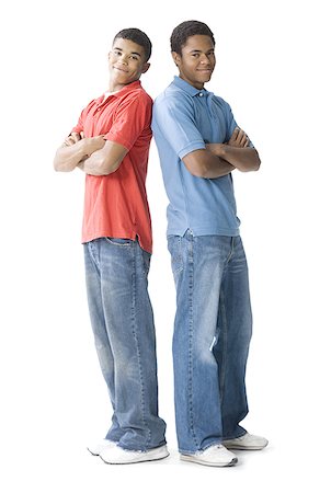 Portrait of two teenage boys standing back to back Stock Photo - Premium Royalty-Free, Code: 640-01362611