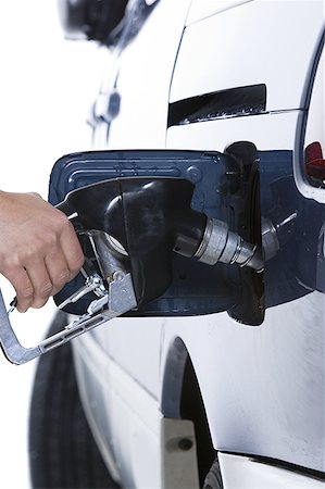 filling up gas - Remplissage de réservoir d'essence Photographie de stock - Premium Libres de Droits, Code: 640-01362671