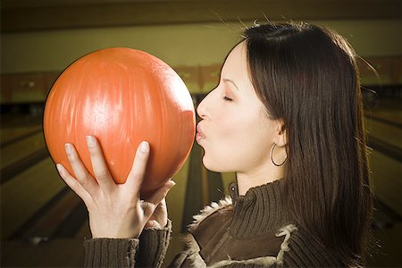 simsearch:640-03265586,k - Profile of a teenage girl kissing a bowling ball Stock Photo - Premium Royalty-Free, Code: 640-01362731