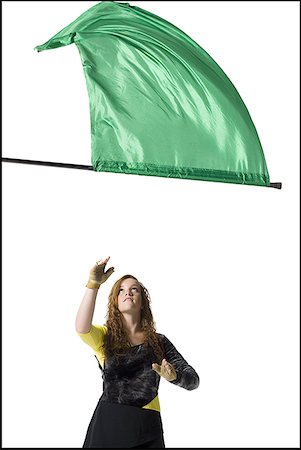 school flag - Female color guard twirling flag Stock Photo - Premium Royalty-Free, Code: 640-01362788