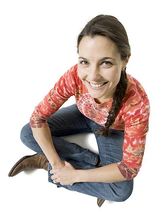 shoe overhead on white - High angle view of a woman sitting on the floor Stock Photo - Premium Royalty-Free, Code: 640-01362886