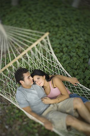 sac à dos - High angle view of a young couple lying on a hammock Foto de stock - Sin royalties Premium, Código: 640-01362882